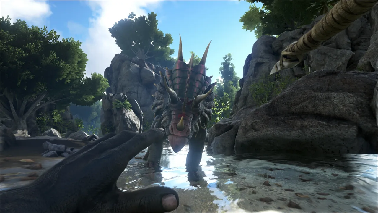 A tribe riding tamed dinosaurs across a grassy valley in ARK Survival Evolved