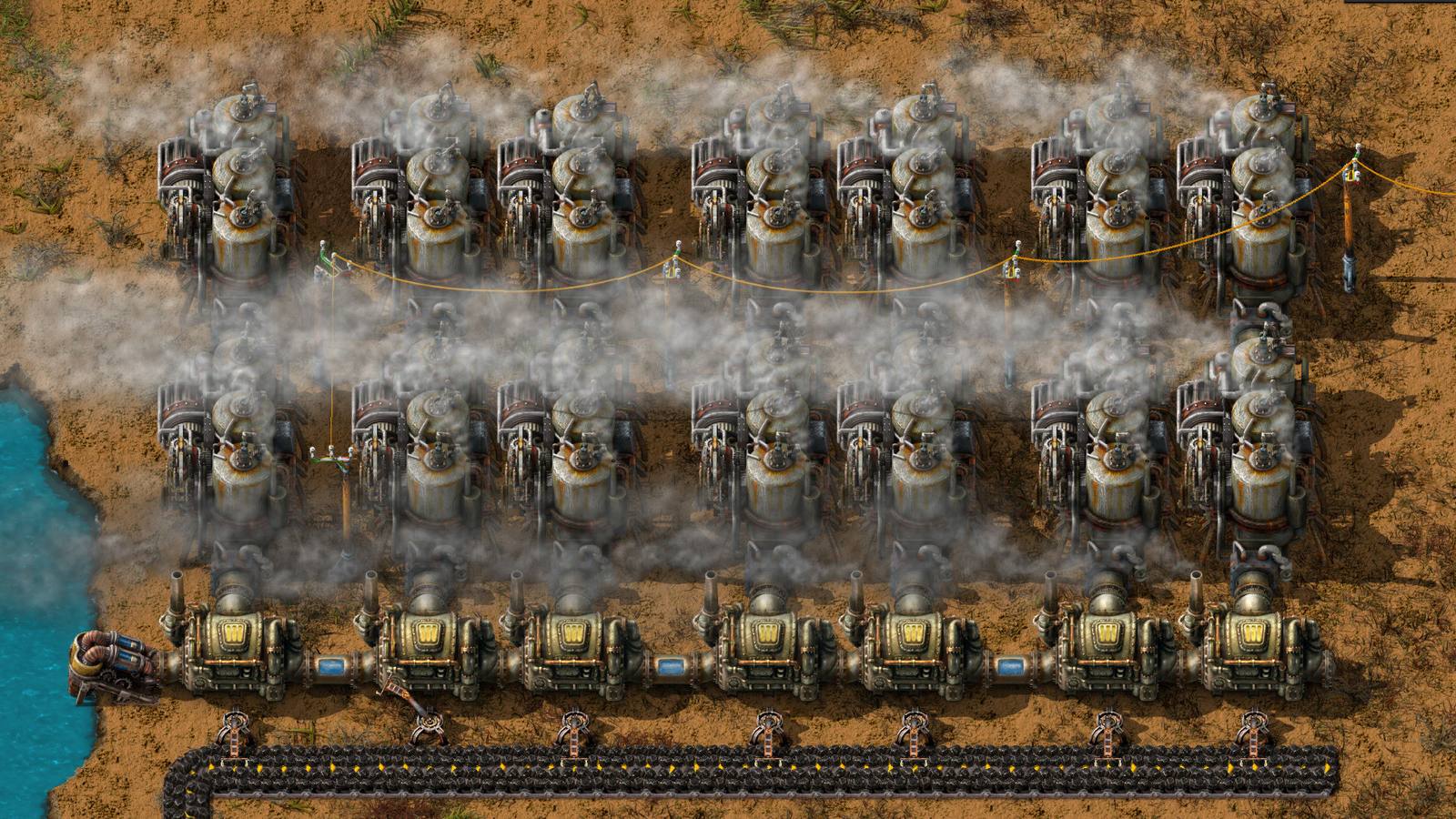 A Factorio factory with trains and belts